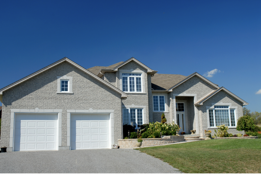 grey brick house with white trim